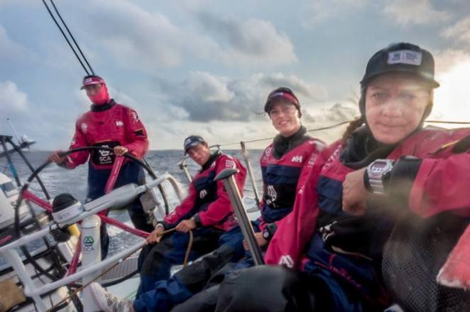 Onboard Team SCA – Sophie Ciszek, Justine Mettraux, Carolijn Brouwer, and Dee Caffarri on deck shortly before the sunsets - Leg six to Newport – Volvo Ocean Race 2015 © Corinna Halloran / Team SCA